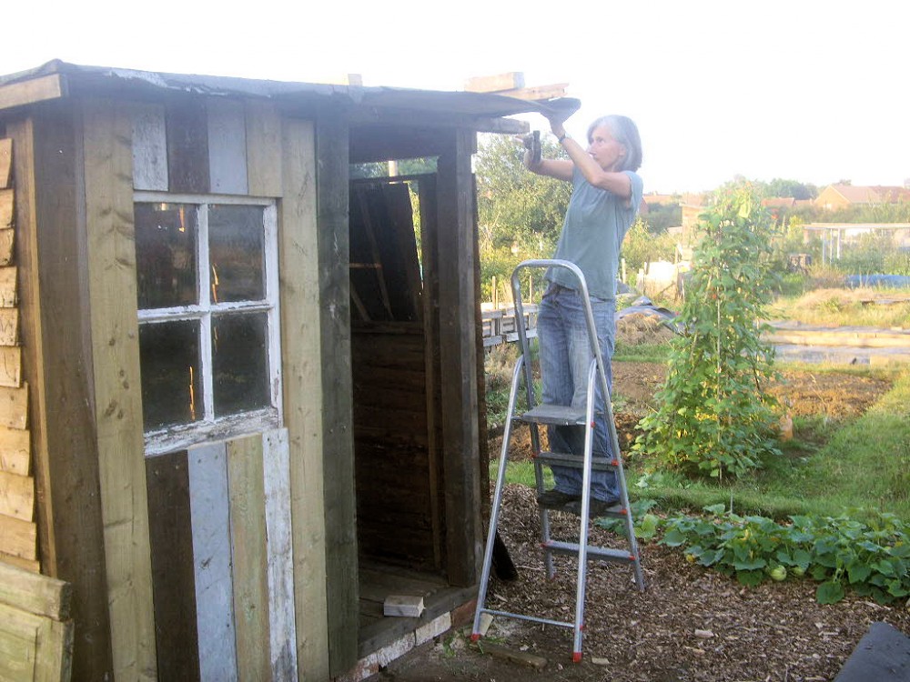 Emma building her shed
